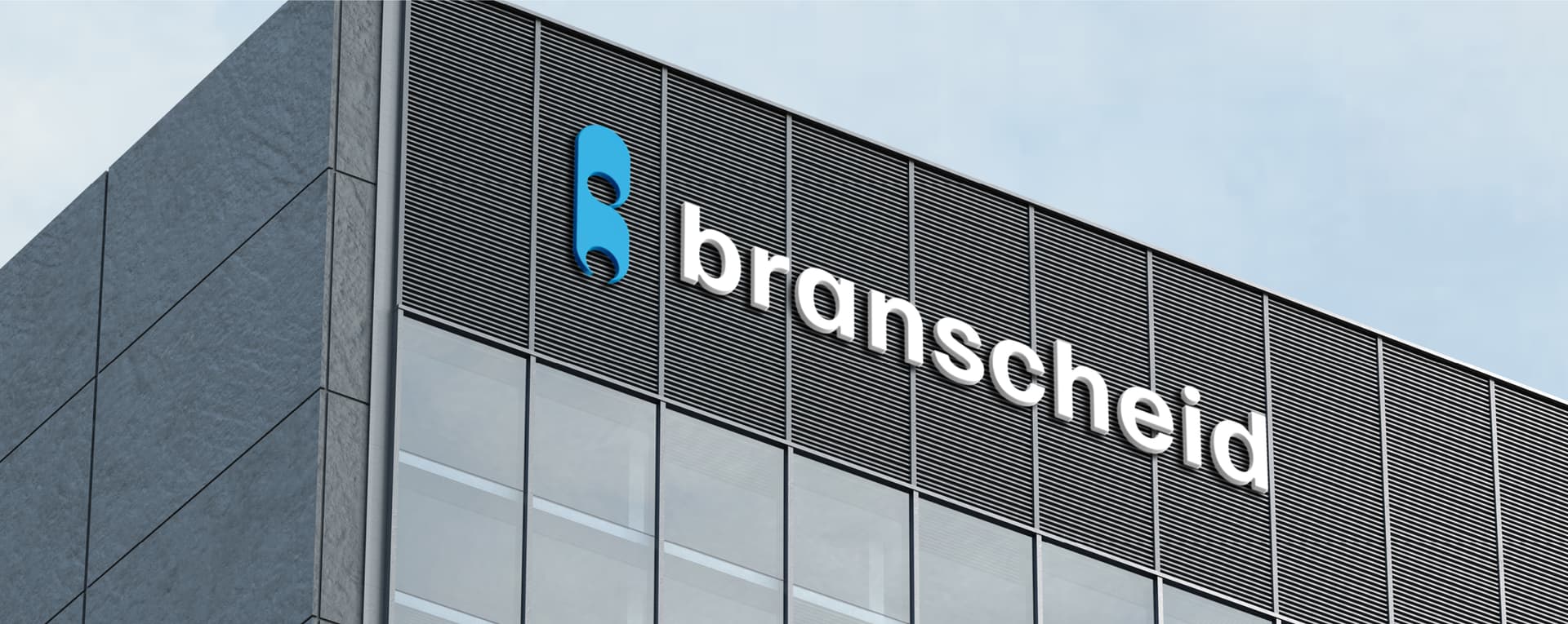 Gebäude mit "Branscheid"-Logo auf Fassade, modernes Design.